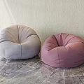 Gray and Pink Bean Bag Chairs on Marble Floor with Light Wall