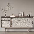 Modern Entryway Console Cabinet With Textured Doors Drawers Decorated Vase Green Plant Picture Frames Sculpture