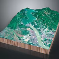 3D Landscape Model With Green Mountains Blue Water And City Below
