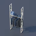 Metal Frame Display Shelf with Folded Blue Clothes on Top and Hanging Dark Clothes Below