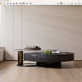 Modern Round Black Coffee Table With Gold Base And Green Apples On Wooden Floor