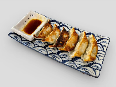 Pan Fried Dumplings With Soy Sauce On Blue And White Patterned Plate 3d model