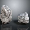 Two Natural Stone Rocks With Rough Reflective Surface Texture On Gray Background