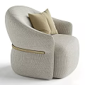 Modern Single Sofa With Beige Accent Pillows Curved Armrests And Golden Trim In Textured Fabric