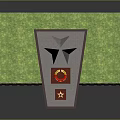 Tall Pointed Top Monument Structure With Green Lawn And Red Plaque Base