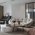 Elegant Modern Living Room Interior With Beige Curved Sofa Marble Coffee Table And Decorative Vases