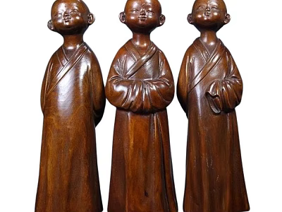 Three Hand Carved Wooden Monk Sculptures With Traditional Robes And Standing Postures 3d model