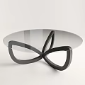 Modern Coffee Table With Glass Top And Black Intertwined Metal Base Design