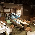 Modern Bar Interior With Wooden Counter Cozy Seating And Dining Tables