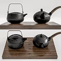 Black Iron Tea Sets Displayed On Wooden Platform With Traditional Design