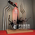 Elegant Banquet Hall Setup With Long Dining Tables Black Chairs And Red Stage Lighting