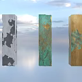 Art Installation Featuring Three Columns Gray Green Gold Patched Textures Against Blue Sky Sunset