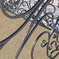 Decorative Wrought Iron Railing With Intricate Scroll Patterns On Wooden Platform 3d model