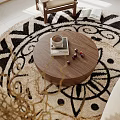 Living Room Interior With Round Wooden Coffee Table And Black White Geometric Rug