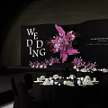 Elegant Banquet Hall With Purple Pink Floral Decorations And Geometric Backdrop Setup