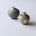 Two Handcrafted Ceramic Jars With Silver Lids Gray And Blue White Patterns