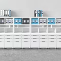 White Office Bookshelf With Open Shelves Blue Black Folders And Drawers