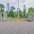 Urban Entrance Gate With Transparent Glass Pavilions Yellow Barriers Surrounding Trees And Distant Tall Buildings