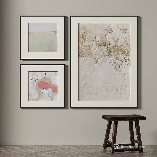 Three Abstract Paintings Hanging On Interior Wall With Textured Neutral Tones And Wooden Stool 3d model 