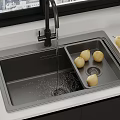 Stainless Steel Kitchen Sink With Running Water And Pears On White Countertop