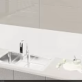 Stainless Steel Kitchen Sink With Modern Faucet On Marble Countertop And Fresh Vegetables