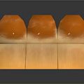 Three Orange Dome Shaped Pastry Desserts With Square Base And Smooth Glossy Surface