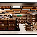 Bright Supermarket Retail Space With Neatly Arranged Shelves Holding Various Grocery And Household Products