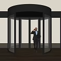 Modern Revolving Door With Glass Panels And Man In Suit Talking On Phone