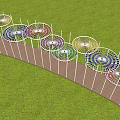 Colorful Pergola Structure With White Columns And Wooden Walkway In Wheat Field