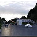 Scenic Mountain Entrance Gate With Misty Natural Surroundings And Cars On Driveway