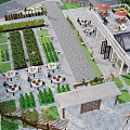Idyllic Rural Landscape With Lush Vegetable Gardens Outdoor Dining Tables Red Umbrellas And People