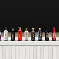 Colorful Wine Bottles And Wine Glasses Arranged On White Shelves With Black Background