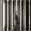 Modern Black Slatted Partition In Lobby Interior Space With Walking People