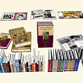 Variety of Books and Magazines with Different Colors Sizes Types Stacked Laid Flat and Opened