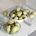 Fresh Green Pears in Glass and White Bowls on Marble Countertop with Glass Cup