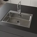 Stainless Steel Kitchen Sink In Modern Kitchen With Black Countertop And Faucet