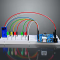 Microcontroller Development Board With Multiple Colored LED Lights And Connecting Wires