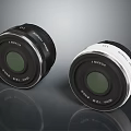 LUMIX Black And White Camera Lenses 25mm F1.7 ASPH Displayed On Reflective Surface