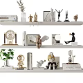Elegant Decorative Ornament Combination On White Shelves With Books Statues Clock Plant And Hourglass