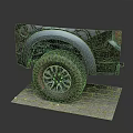 Black Pickup Truck Rear View With Large Off-Road Tires Silver Fender Flares On Brick Pavement