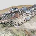 Abandoned Rusted Metal Construction Components With Scattered Stones And Sandy Soil