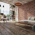 Industrial Office Space With Exposed Brick Wall Wooden Floor Sofa Bookshelf And Pendant Lights