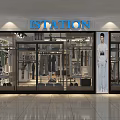 Modern Clothing Store Interior With Clothing Racks Displayed Garments And Seating Area