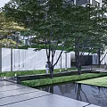 Residential Landscape With Trees White Wall Steps Green Lawn Gray Pavement And Black Chairs