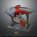 Colorful SciFi Style Toy Gun Prototype With Red White Yellow Blue Accents On Gray Stand
