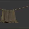 Brown Towel With Yellow Trim Folded Hanging On A Rope In Laundry