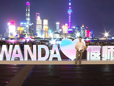 3D Wanda Letters Illuminated Against Night City Skyline With Skyscrapers Person And Heart Shape 3d model