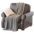 Brown Leather Single Sofa with Herringbone Pattern Blanket and Striped Pillow 3d model