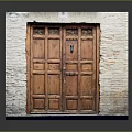 Classic Wooden Entrance Double Door With Brick Wall Frame And Intricate Carved Details