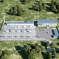 Industrial Factory Complex With Multiple Buildings Parking Area And Green Trees